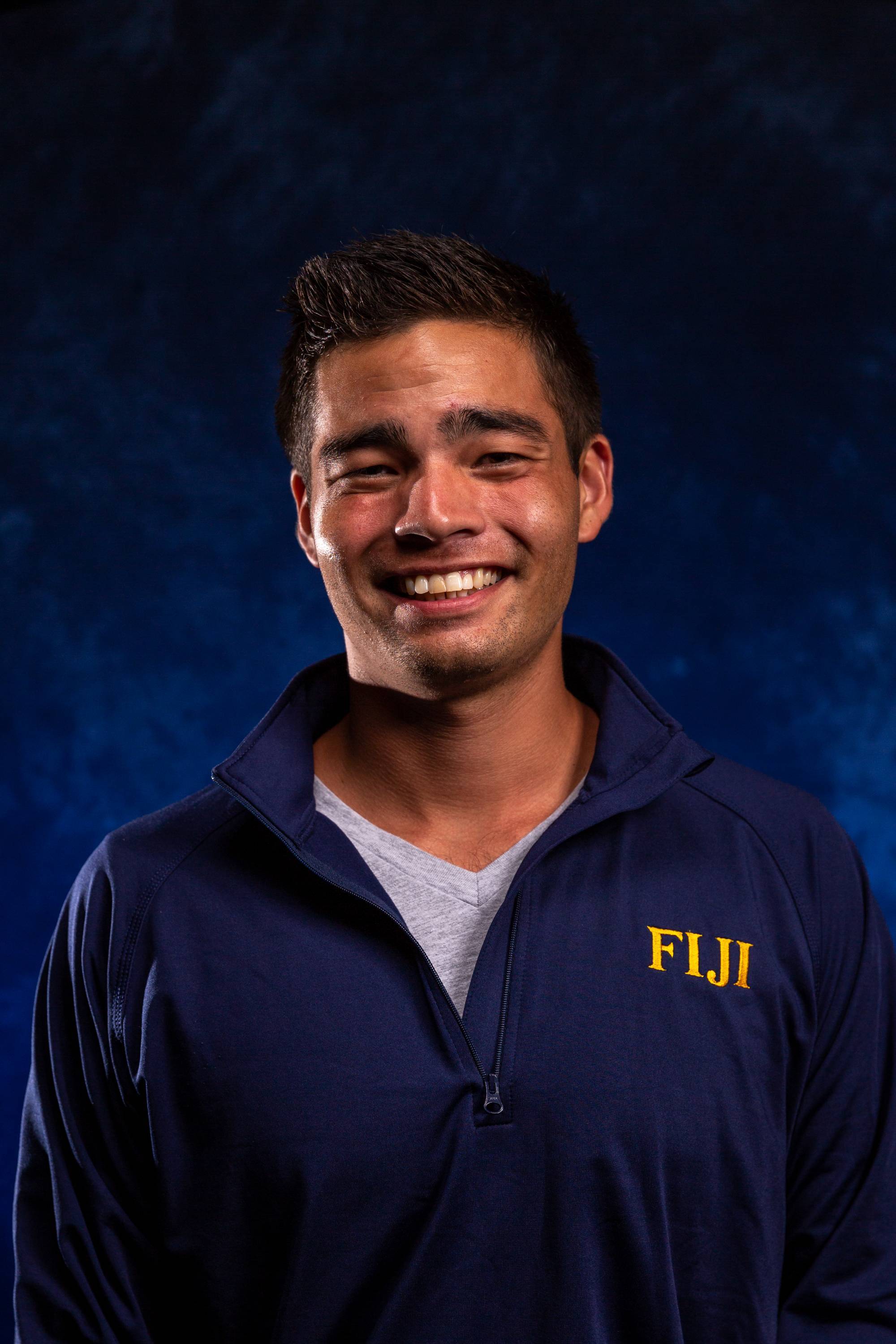 Sample Head-shot in front of dark blue background